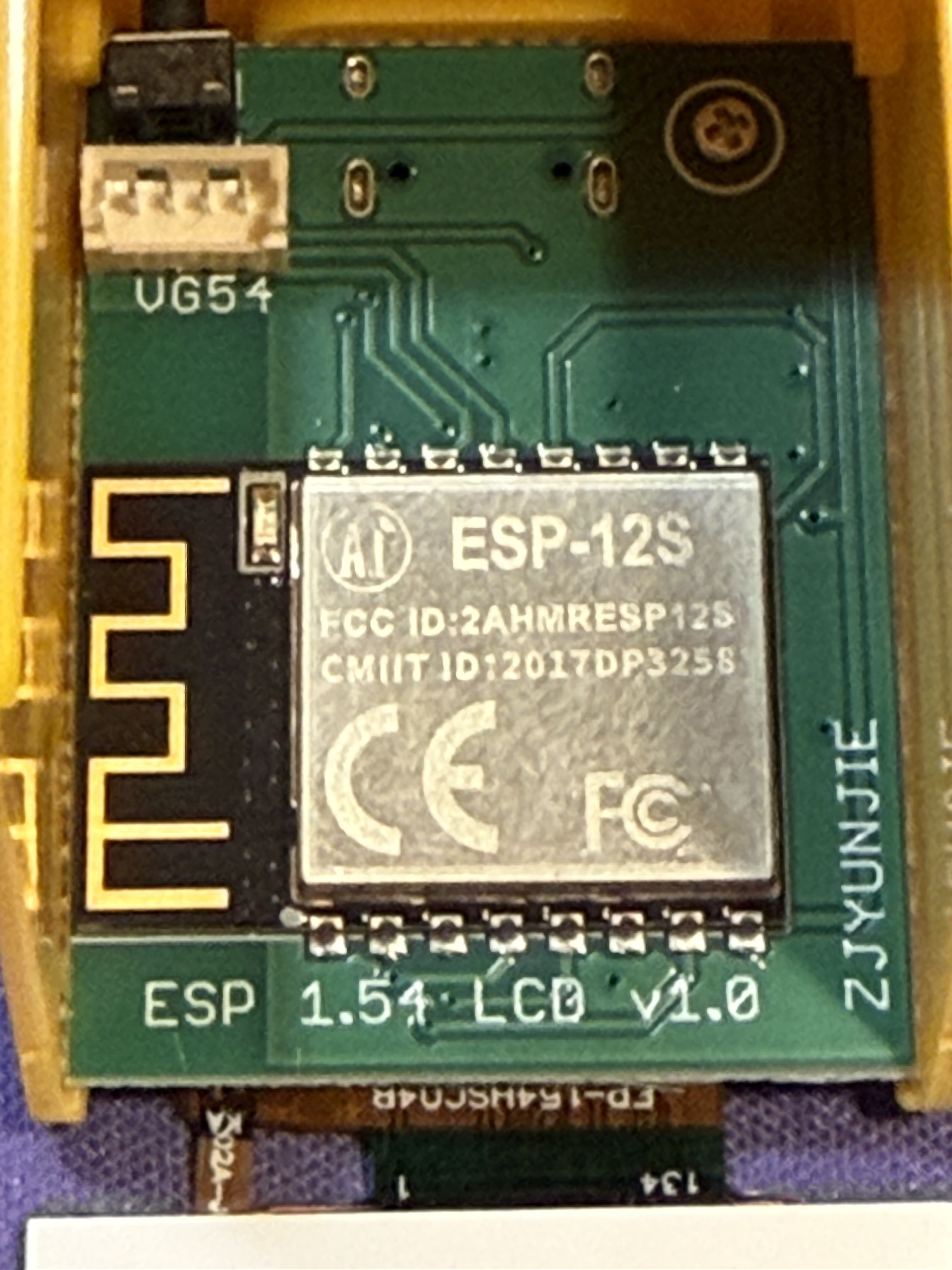 Close-up of the ESP-12S module with its FCC ID (2AHMRESP12S), CE marking, and the PCB antenna