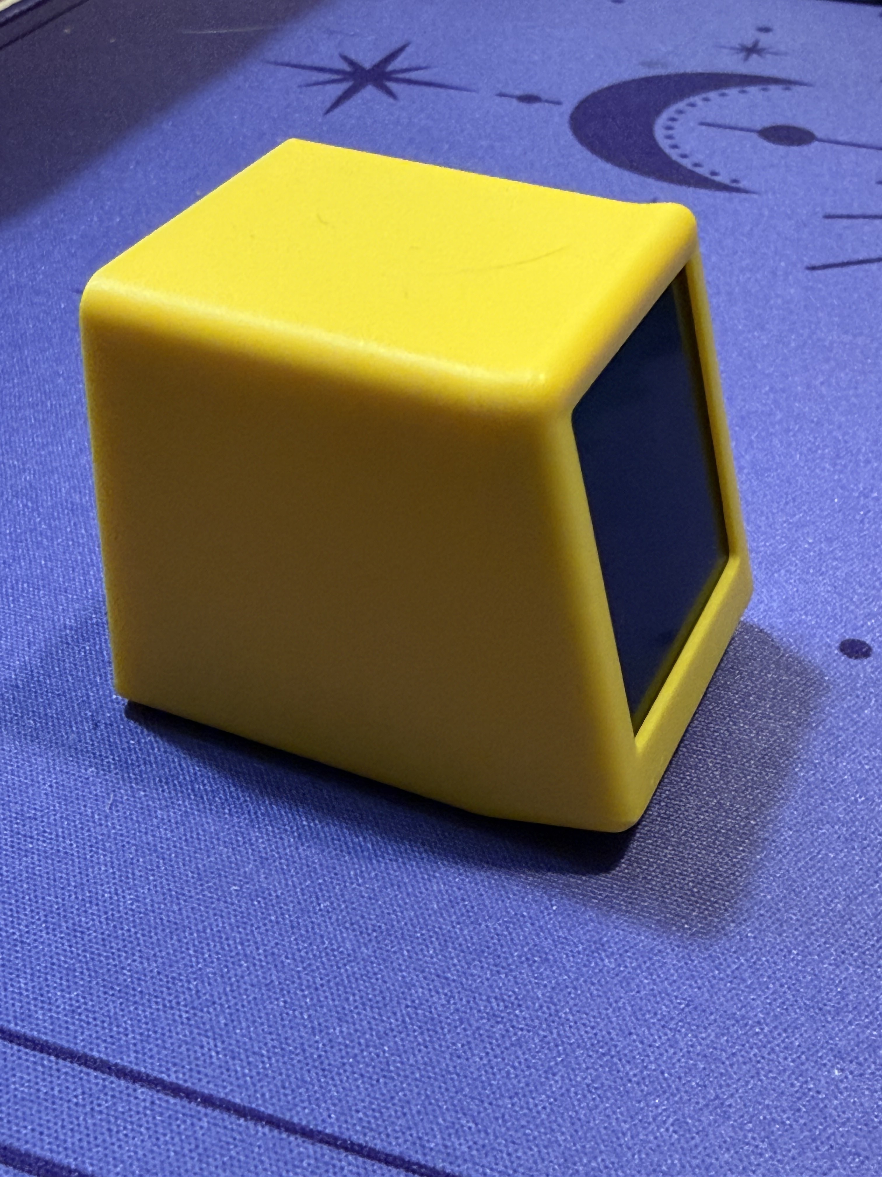 Another angle of the yellow cube, showing the front and side